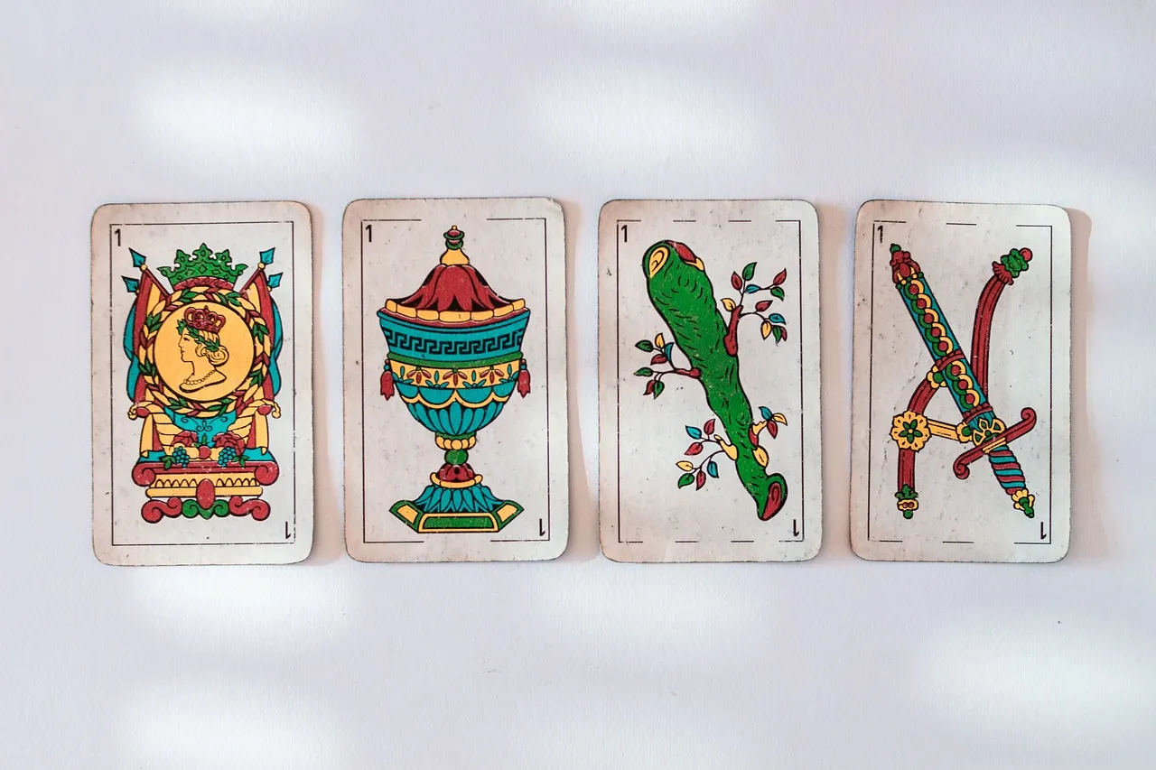 Dos De Bastos Tarot: Love, Career, and Money Insights